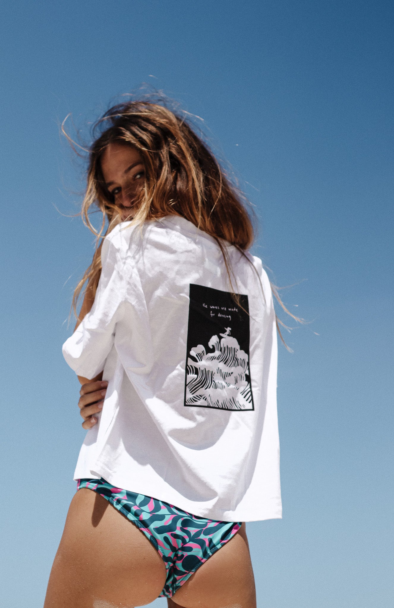 white cotton boxy women's t-shirt with from and back print with surfer illustration - the waves were made for dancing - loose fit