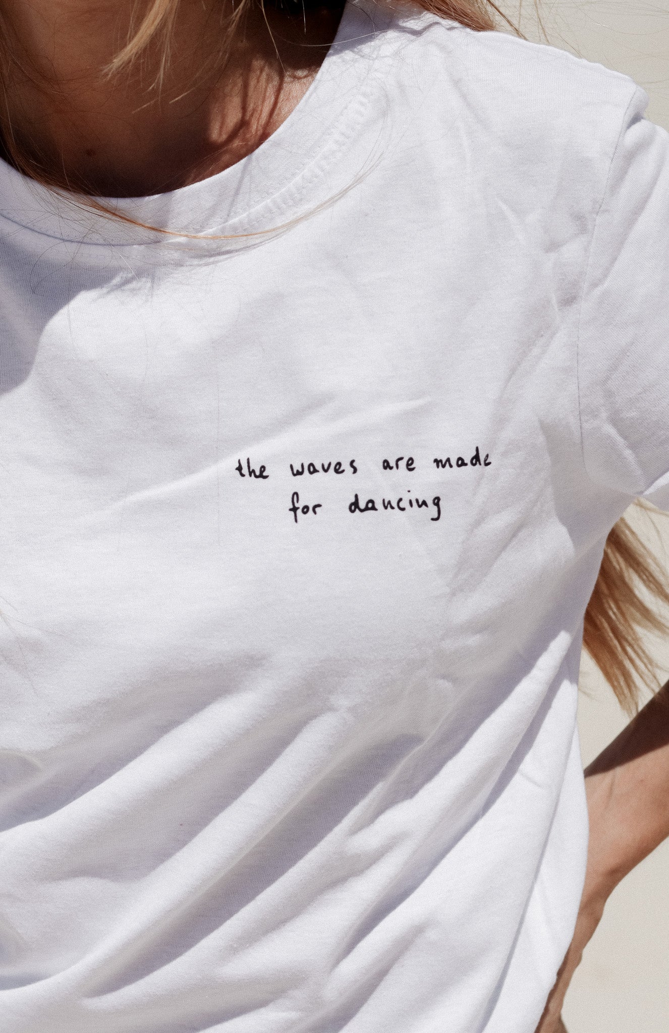 white cotton boxy women's t-shirt with from and back print with surfer illustration - the waves were made for dancing - loose fit