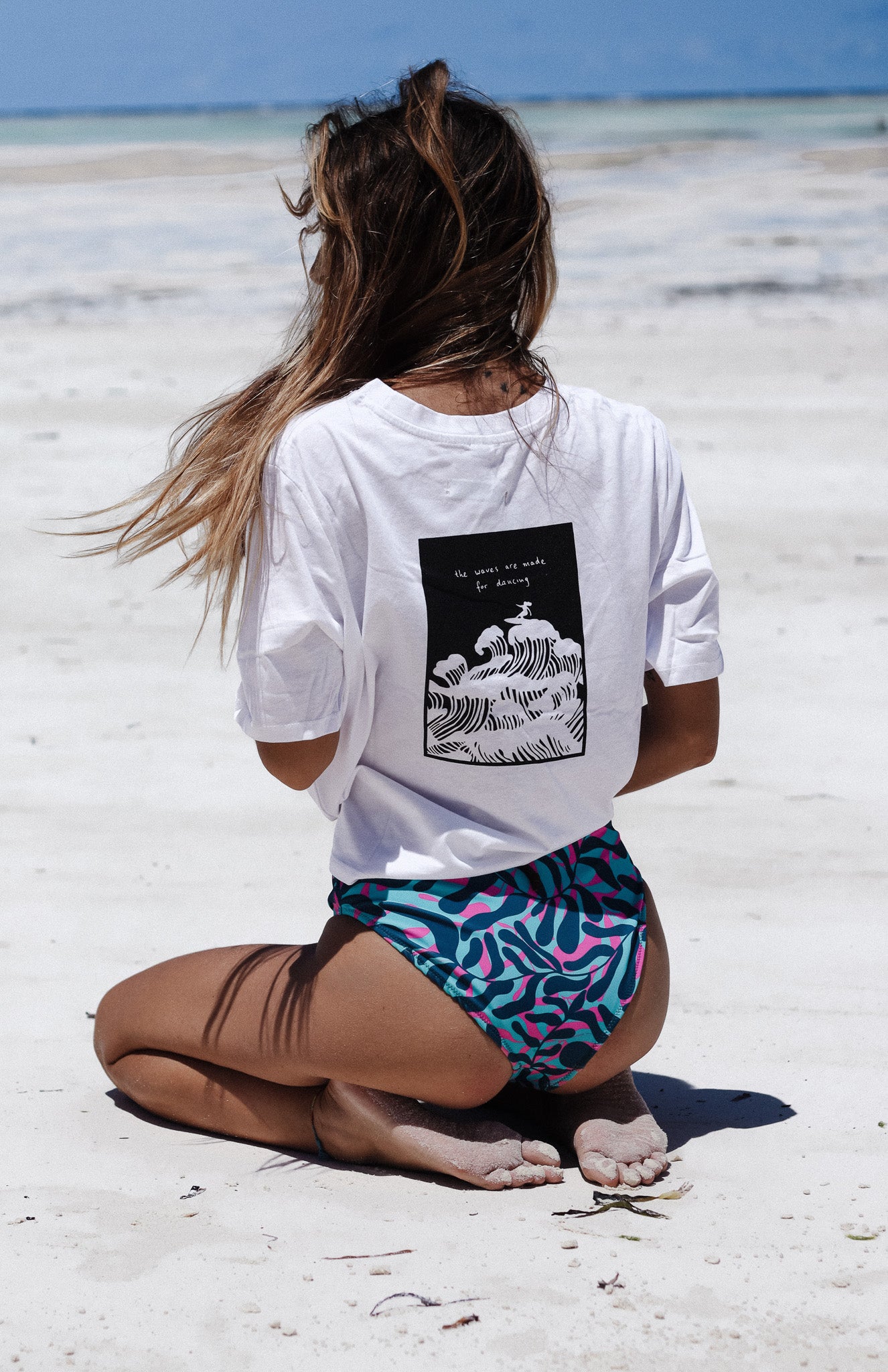 white cotton boxy women's t-shirt with from and back print with surfer illustration - the waves were made for dancing - loose fit