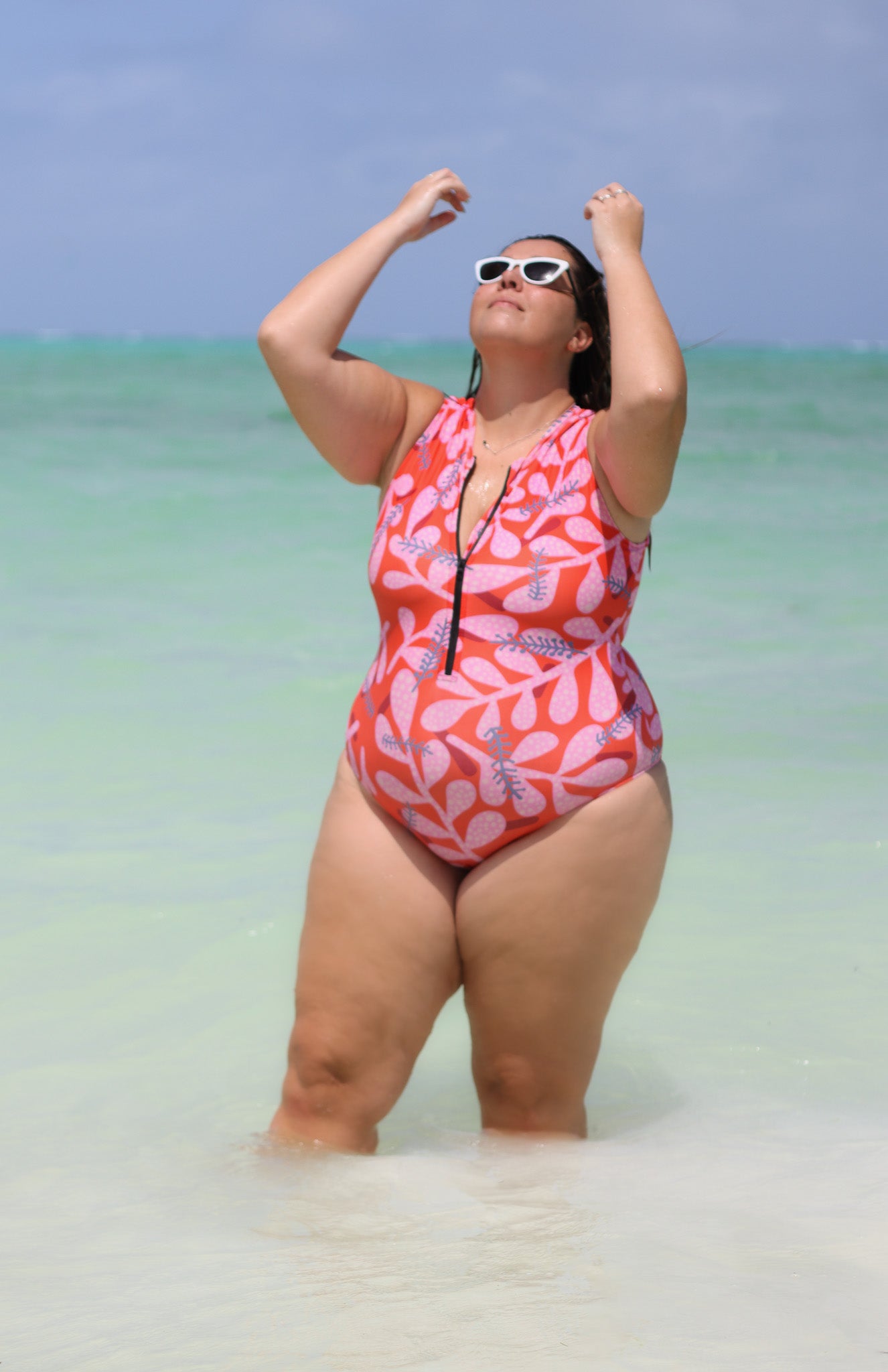 sleeveless surf suit rash guard from lycra with front zipper for women with a print with red orange base with pink and green flowers plus size