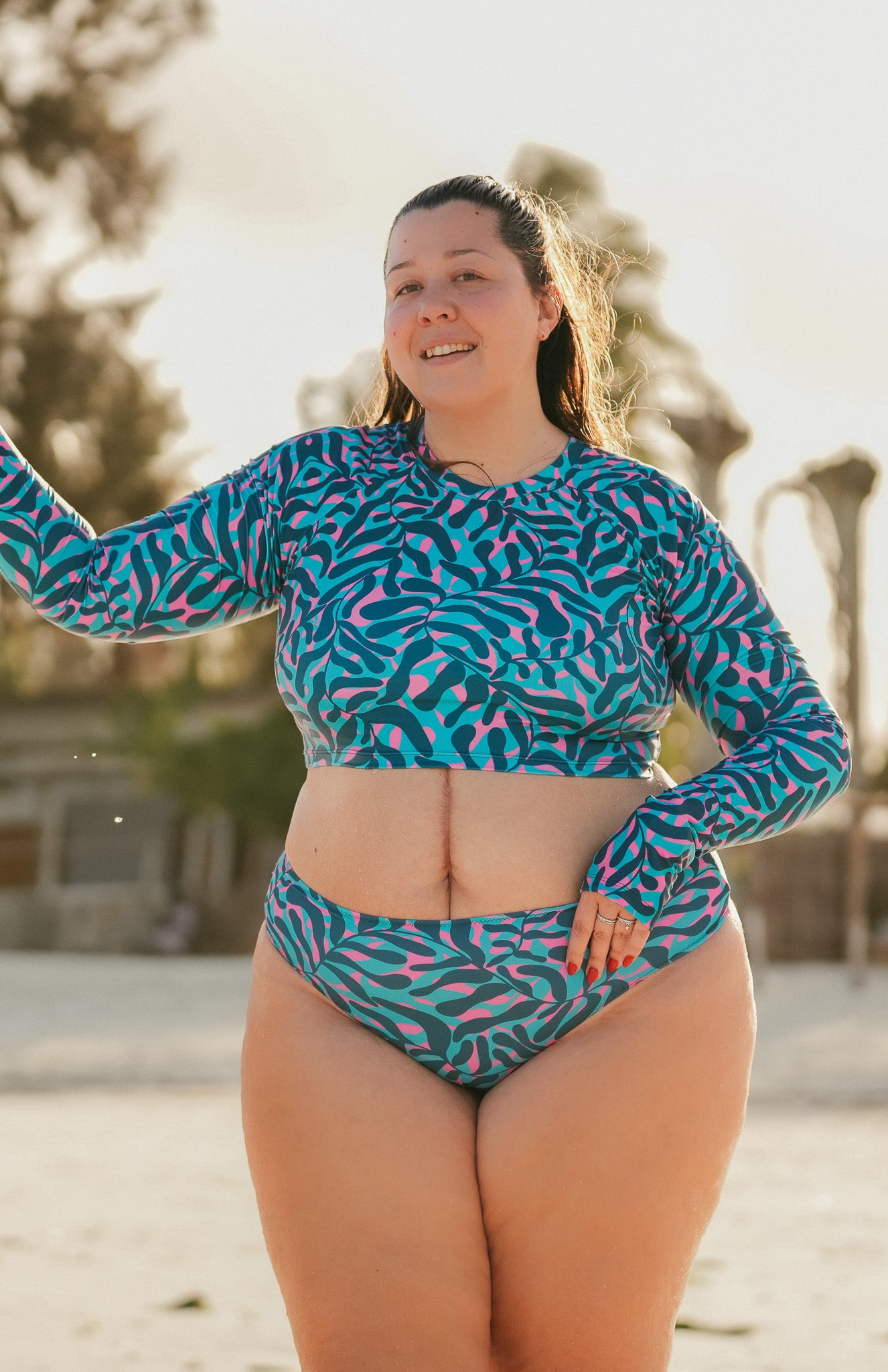 cropped top rash guard for practicing water sports, like surfing or kiting, as well as enjoying life at the beach with a s print with blue, turquoise and pink with finger holes - part of a set with bikini - plus size